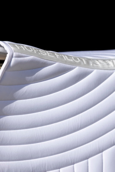 Ergonomic mixed saddle pad