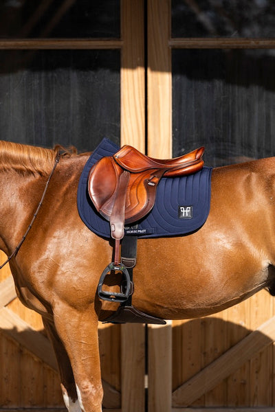 Ergonomic mixed saddle pad