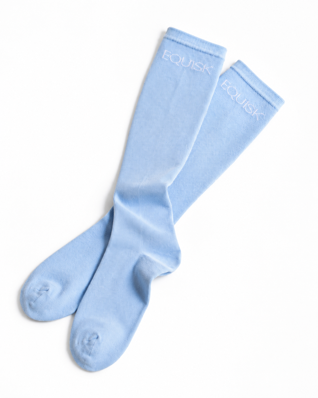 Pair of equisk light blue socks on a white background