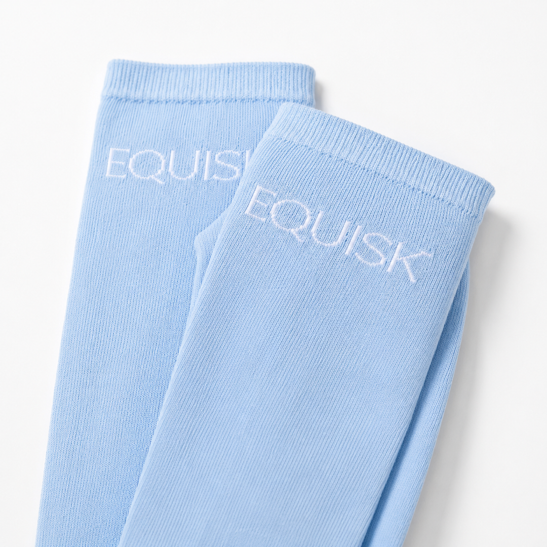 Light blue socks with 'EQUISK' branding on a white background