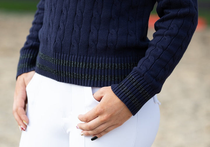 Close-up of Wilma Sport Signature Sweater cuff and hem glitter trim in Midnight Navy — refined cable knit detail.